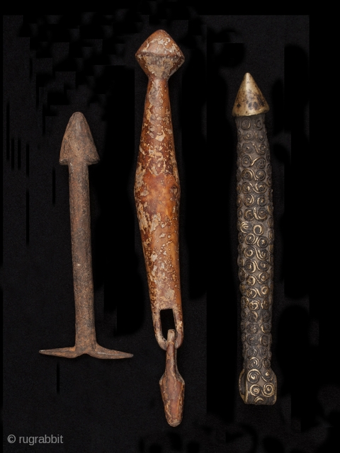 Phallus amulets,
Burkina Faso.
Iron, wood, bronze
6" (15.2 cm), 9" (23 cm) and 7.25" (18.4 cm) high.
Mid 20th century

These are either amulets of fertility or an indication of male prowess.     