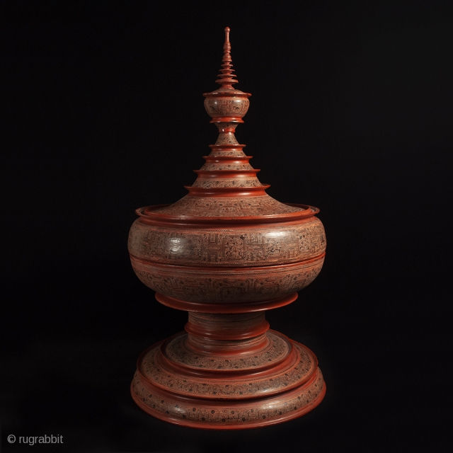 Large offering vessel, hsun ok, Pagan, Burma. Bamboo, lacquer, pigment, 33″ high by 18″ diameter (84 by 45.7 cm), Late 19th or early 20th century.

An imposing offering vessel composed of six pieces,  ...