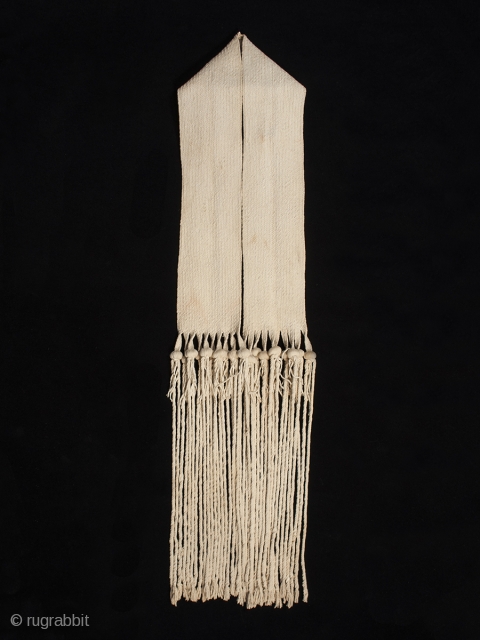 Hopi rain sash, San Juan Pueblo, New Mexico. Hand woven cotton, corn kernels, mid 20th century, 94" (238.6 cm) long by 5.5" (14 cm) wide. Ex. private collection, New York.


This rain sash  ...
