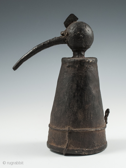 Iron jeweler's torch, Karnataka, South India, 7" (17.7 cm) high, late 19th to early 20th century. These torches often took avian form and this odd bird has quite a unique presence.
  