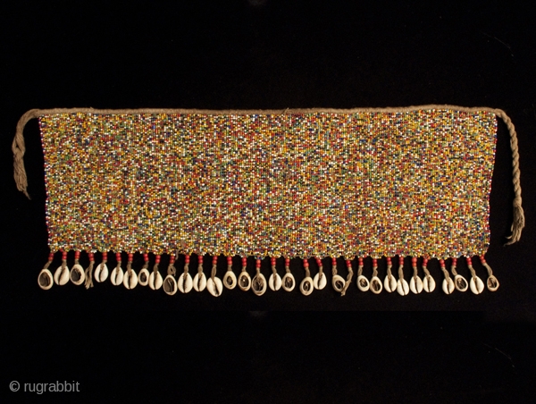 Pikuran (cache-sex),
Kirdi people, Cameroon.
Seed beads, cotton string, cowrie shells.
21" (53.5 cm) wide by 8.5" (21.5 cm) high.
Mid 20th century
#1640              