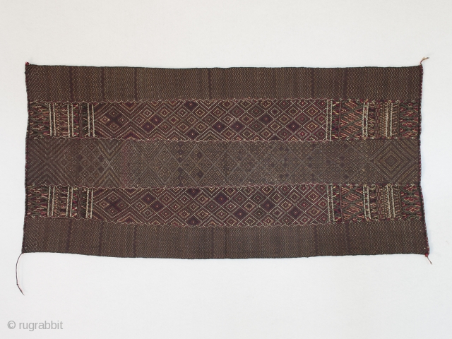 Breast cover, Chin ethnic group, Burma. Cotton, silk, 13.5" (34.2 cm) high by 28" (71 cm) wide. Early to mid-20th century. This is a wonderful diamond patterned breast cloth made with discontinuous  ...