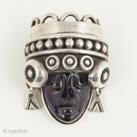 Aztec head brooch or pin, Talleres de los Ballesteros, Taxco, Mexico. Silver, amethyst, Mid-20th century. 1.75" (4.5 cm) high. A beautifully carved amethyst head of Aztec royalty set into a sterling silver  ...