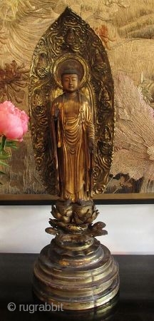 17th Century Japanese Standing Amida Buddha Statue

Stunning original 17th century Japanese Amida Buddha statue, gold gilt over wood with inlaid crystal on his third eye and his crown chakra. He stands on  ...