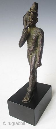 Rare Antique Egyptian Bronze Walking Nobleman

Rare Antique bronze figure of a nude nobleman in walking pose, his pointer finger of his right hand resting up against his chin, with green patina and  ...