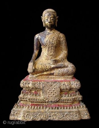 Antique Thai Seated Gilt Bronze Buddha

Gilt bronze Buddha seated with serene expression. Intricate metal granulation on drapery and throne. Details of red lacquer on tiered trapezoidal seat. Thailand. 

Early 19th century 

Dimensions:  ...