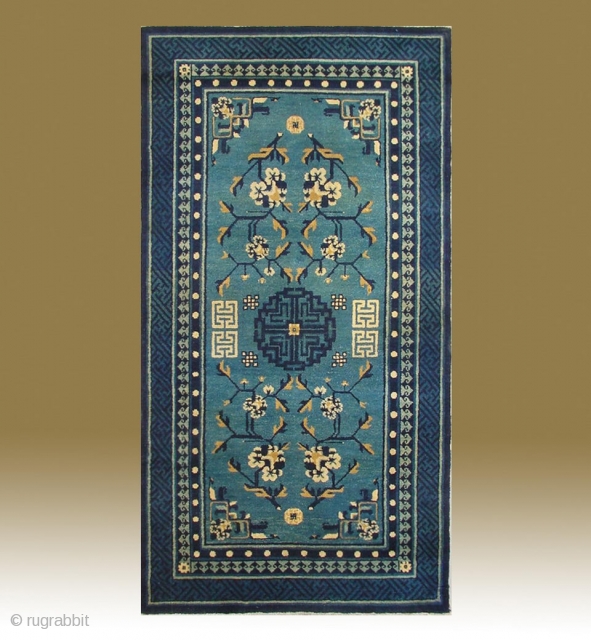 No.P95 * Chinese Antique Rug ,Origin:Beijing.Age:Late 19th Century.
Size:87x161cm(2'10"x5'3").Shape:Rectangle. Background Color: Blues and Greens. 
This sleeping carpet (khaden) has a single central medallion in a double dorje (a Tibetan male symbol) pattern. The  ...