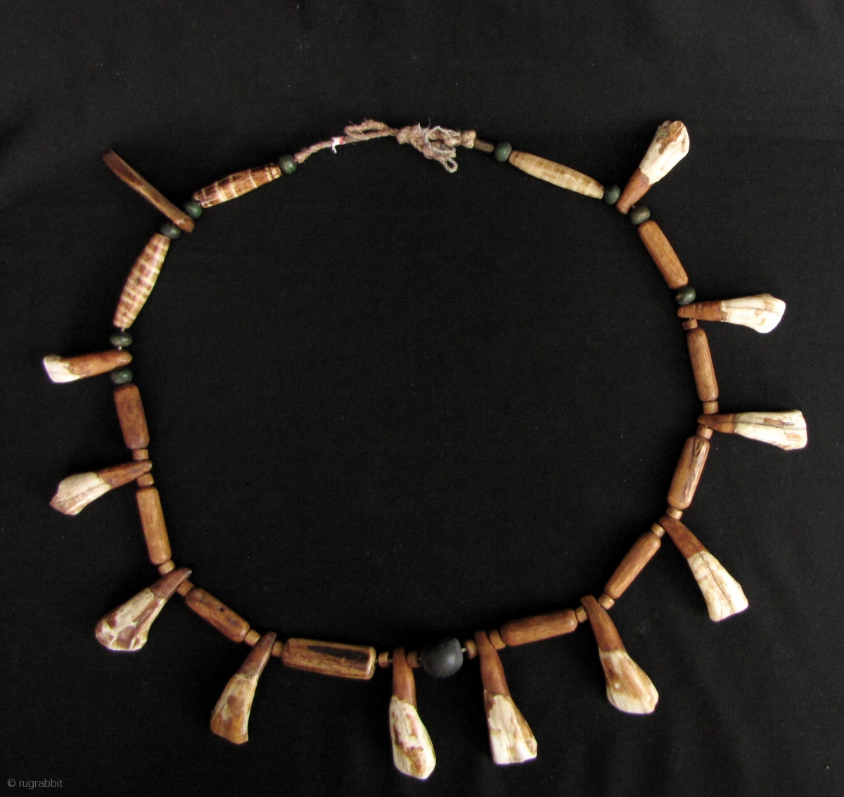 Chin Animal Bone Necklace: Eclectic strand of spherical wood