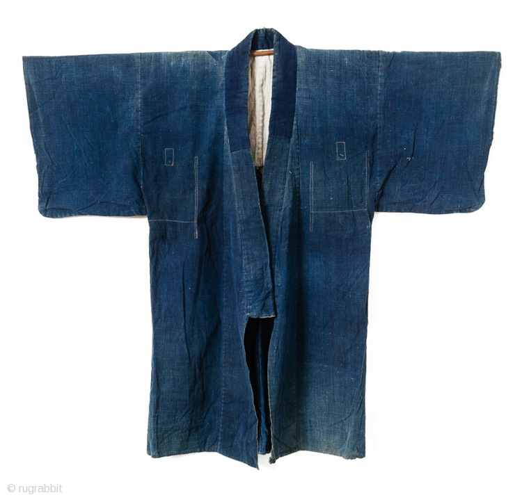 This is a large Japanese indigo dyed jacket, or hanten, decorated with ...