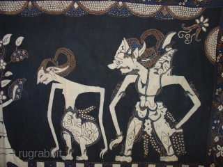 Handsome Wayang Batik from Java: Circa 1925. Good condition with a couple of small holes and light fading on one side. Deep indigo.          