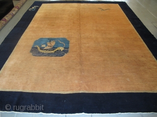 Art Deco Chinese Carpet 3.45m x 2.73m (11'3" x 9') with a distinctly nautical theme. Four elements decorate the entire carpet; a sampan and seagull in the abrashed salmon field,and 2 sea  ...