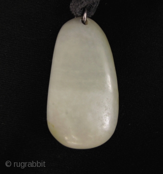 Hetian Jade Pebble Pendant 和田玉: Subtle nephrite “pebble” jade stone with original russet skin highlights, from Xinjiang. It has been polished on one side to achieve symmetry but other then that this  ...