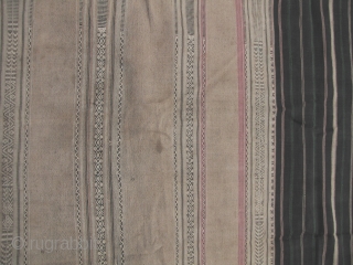 Semi antique woman’s sarong from the Stieng/Xtiêng ethic group Vietnam. Over 60 years old, this is woven from all handspun cotton threads. There is one ink stain and a small hole (see  ...