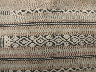 Semi antique woman’s sarong from the Stieng/Xtiêng ethic group Vietnam. Over 60 years old, this is woven from all handspun cotton threads. There is one ink stain and a small hole (see  ...