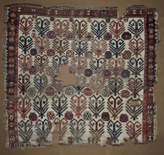 Central Asian (Kyrgyz?) fragment, 
19th century, 126x135 cm. (professionally mounted)
This fragment corresponds to the upper half of the entire rug. The main motif is composed by parallel rows of trees (or open  ...