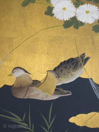 A very stylish smaller screen featuring a simple, elegant design of ducks on a black river among golden clouds, 91cm x 167cm (36 x 66 inches). Old Tokyo gallery label to reverse,  ...