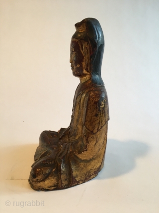 Chinese Guanyin figure, around 1700. Wood, traces of lacquer. This figure still has individual features, distinguishing older examples. Beautiful and serene. Size 8.7 x 5.1 x 4.3 inch (22 x 13 x  ...