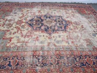 antique oversize serapi heriz rug worn condition beautiful colors has been cleaned no dry rot 2 big holes and 3 tear in one side easy restoration for huge profit measures 11' 7"  ...