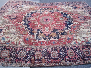 antique heriz serapi rug measuring 9' 5" x 11' 3" great design and colors has wear but solid rug very floppy  both ends and sides are good no holes clean rug  ...