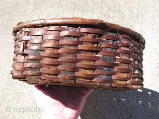 Antique Native American Mohegan basket, hand woven ash, Connecticut, 19thC, the spokes are swabbed blue, the weavers are swabbed red, general good condition and strong, but some broken weavers, the approximate size  ...