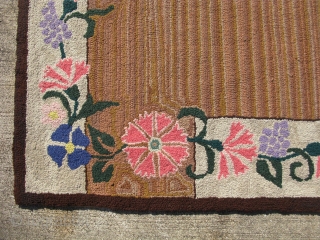 Semi-antique American hooked rug, hand hooked cloth strips on burlap, ca.1940, the variegated striations are very nice, both sides are shown, the approximate size is 25 inches x 37 inches, general good  ...