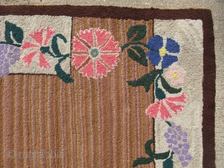 Semi-antique American hooked rug, hand hooked cloth strips on burlap, ca.1940, the variegated striations are very nice, both sides are shown, the approximate size is 25 inches x 37 inches, general good  ...