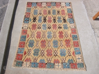 Antique yellow ground Konya rug, hand knotted wool, Central Turkey, 1st QTR 20thC, rose, blue, strong condition with no holes or repairs, the ends and sides are intact, the abrash of black/brown  ...