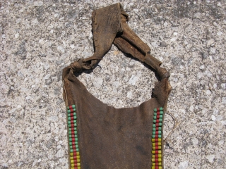 Old African modesty apron, cache sexe, for a young girl, Turkana People of Kenya, hand embroidered glass beads on hide, sinew sewn and sewn with hide strips, soiling, stiffness of hide due  ...