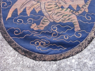 Antique Chinese embroidered roundel, fine couching of metal threads and peacock feathers on blue silk, originally the flying tiger emblem was used on military banners in the 17th and 18th centuries, this  ...