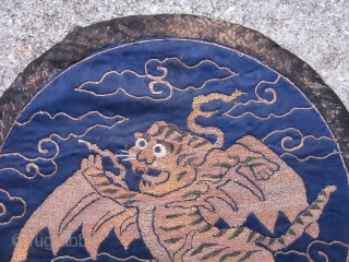 Antique Chinese embroidered roundel, fine couching of metal threads and peacock feathers on blue silk, originally the flying tiger emblem was used on military banners in the 17th and 18th centuries, this  ...