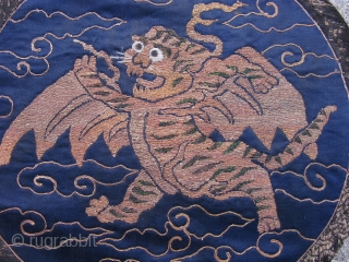 Antique Chinese embroidered roundel, fine couching of metal threads and peacock feathers on blue silk, originally the flying tiger emblem was used on military banners in the 17th and 18th centuries, this  ...