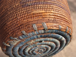 Old African basket, finely hand coiled plant fiber, some weavers dyed indigo, Tutsi People of Rwanda, prior to 1950, it has a beautiful patina that only comes with age, the Tutsi are  ...