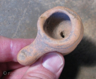 Antique clay pipe, Pre-Columbian North East Mexico, made in the shape of a peyote plant, most of the peyote plant grows underground, what is shown here is the decapitated root without the  ...