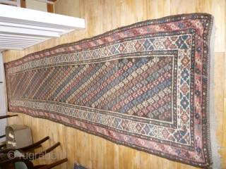 Thick chunky heavy caucasian runner. Plenty of floor use left. One small tear (repaired) shown. Coarse weave.385 by 100cm. Please ask for more photos if needed       