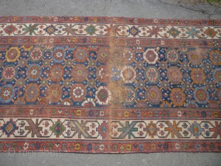 19th century Kurdish/NW Persian runner. Needs a good clean. Edges secured. Bit of a cut at one end. Some wear. Sensibly priced. Photos taken on a very bright day so a little  ...