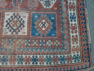 19th century kazak. Couple of tears and some wear but some good colours and appealing design elements. 188 by 139 cm. ask for more photos if you want.     