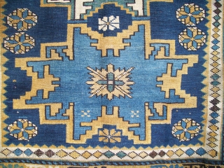 An unusual Lesghi rug with Chichi borders. Circa 1900, size 6'x3'10" [117cm x 183cm]. All wool. Excellent condition, original sides, and a nice floppy handle. 
       