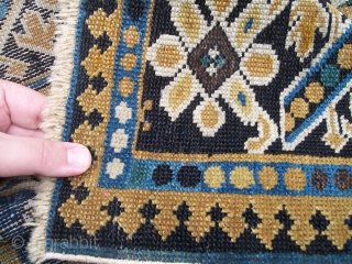 An unusual Lesghi rug with Chichi borders. Circa 1900, size 6'x3'10" [117cm x 183cm]. All wool. Excellent condition, original sides, and a nice floppy handle. 
       