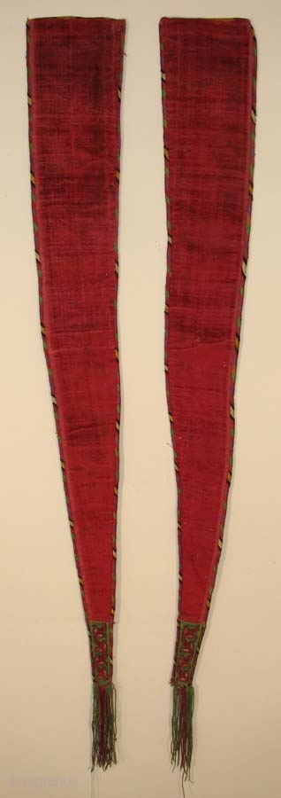 Turkmen false sleeves, silk embroidery with handmade velvet, late 19th/early 20th century, 45" long (including fringe) x 5.5"               