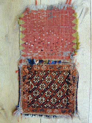 antique Qashqai chanteh bag complete with back late 19c size 28x28 cm(front).
Thick fine bijar like weave all wool and natural dyes .Selvedges original  need rebinding, top and corners nibbled. Interesting remnants  ...