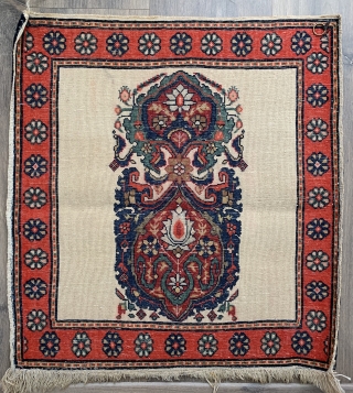 Very sweet little sarouk poshti excellent condition has been hanging (loops)
Tiny bit colour run to centre only front and back could be removed size 56 x 52 cm. 
     ...