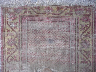 Ancient ethereal Khotan rug with an unusual design, complete and in ghostly condition.                    