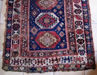 
A 19th Century Memling-gul Kazak

Size 133 x 202 cm

Great colours, including aubergine, pale green, yellow, two reds and two blues
Interesting borders with a naively drawn 'crab border' at one end. Pile is  ...