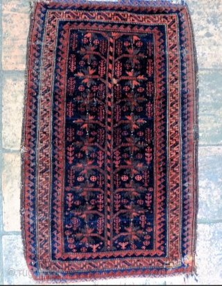 A 19th Century Baluch Balisht
Size 92 x 57 cm

With very silky wool and subdued colours this probably quite an early piece. In overall fair to good condition, with a small repair to  ...