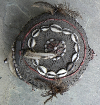 Old Naga Cane Woven Hat, from the state of Nagaland in NE India, probably Konyak, with lots of decorations, including boar tusk, glass beads, cowrie shells, sea shells, wood, bone, and feathers.  ...