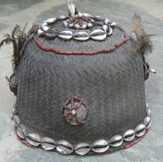 Old Naga Cane Woven Hat, from the state of Nagaland in NE India, probably Konyak, with lots of decorations, including boar tusk, glass beads, cowrie shells, sea shells, wood, bone, and feathers.  ...