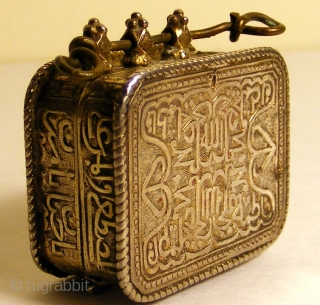 Koran Box with Inscription of Koranic Verses

A rare Koran box worn as a amulet pendant.
The inscription of Koranic verses are in TUGHRA form and are reposed .Box is provided with four delicate  ...