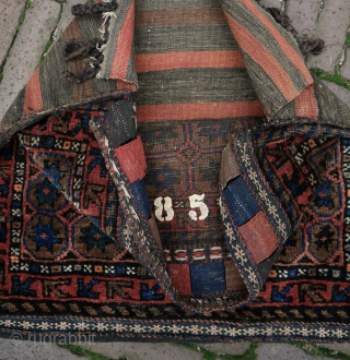 Happy New Year
Rare and beautiful Baluch bag with tile pattern and stars, prob with camel hair, natural colours, apart maybe from the small silk orange knots, very good condition, complete closing system,  ...