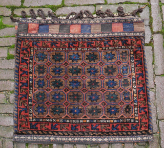 Happy New Year
Rare and beautiful Baluch bag with tile pattern and stars, prob with camel hair, natural colours, apart maybe from the small silk orange knots, very good condition, complete closing system,  ...