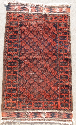 Fine Antique Baluch Rug, Great scale and drawing with several dark blues and practically sculptural corrosion to the browns. Khorosan variety an all-over repeat field derived from flatweaves and a boldly drawn  ...